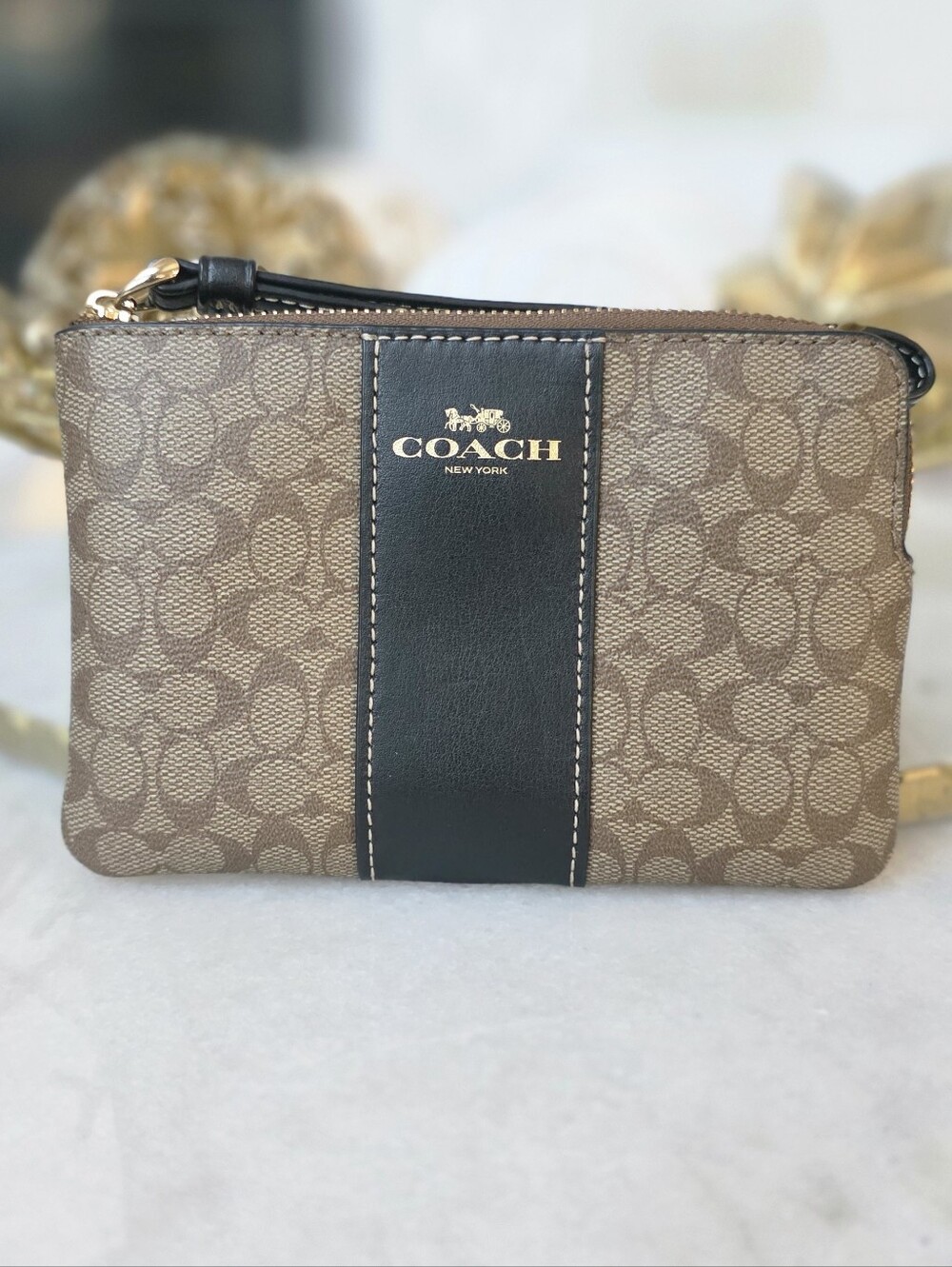 COACH Signature Canvas Wristlet in Khaki and Black.